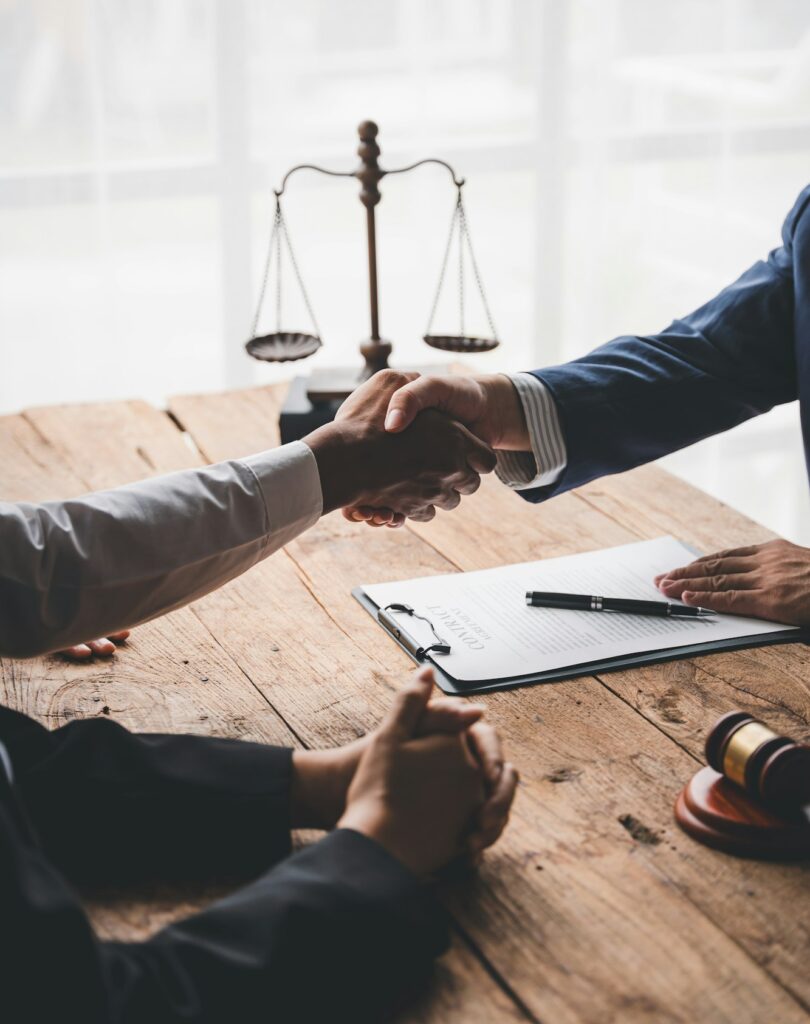 concept of justice and law A male judge in the courtroom on a wooden table and a male counselor or l