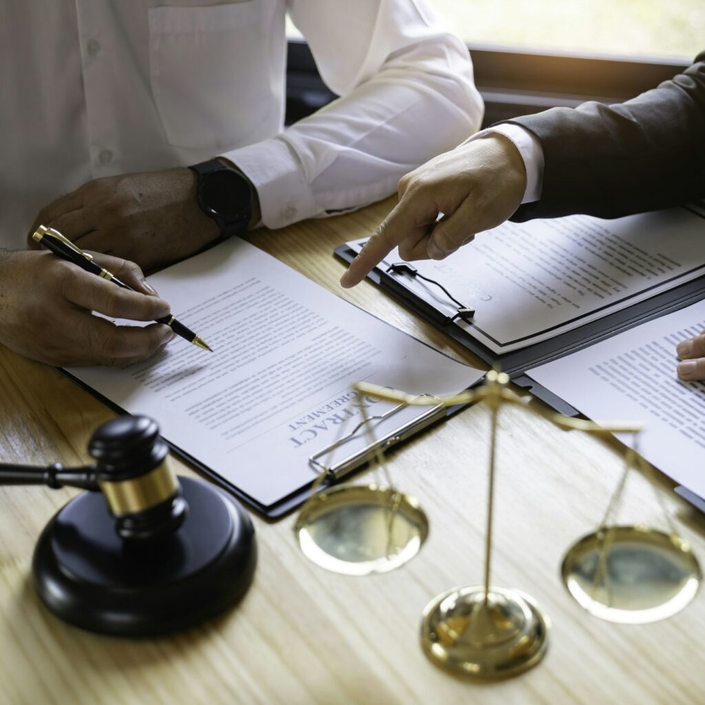 Attorneys or lawyers who are reading the statute of limitations Consultation between male lawyers an