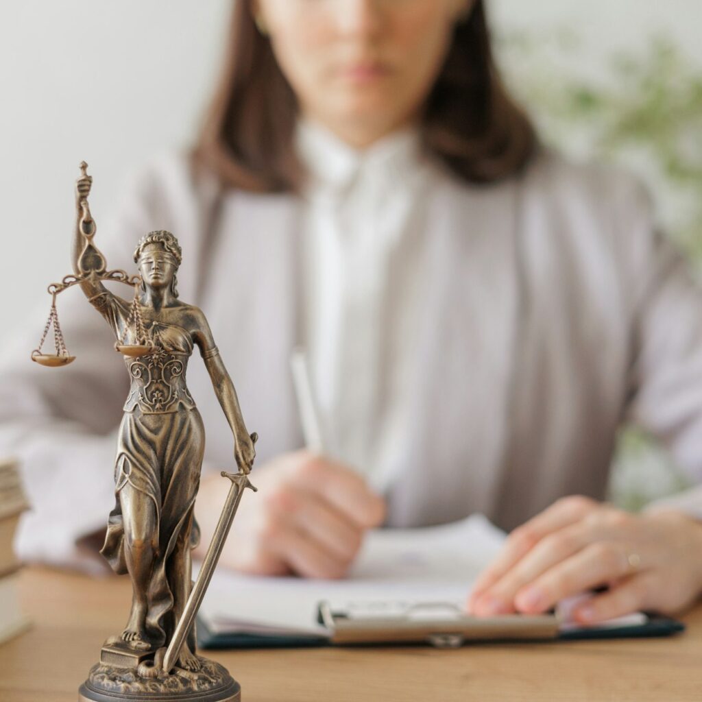 legal advice in the office or online. a female lawyer checks a legal contract. the lawyer